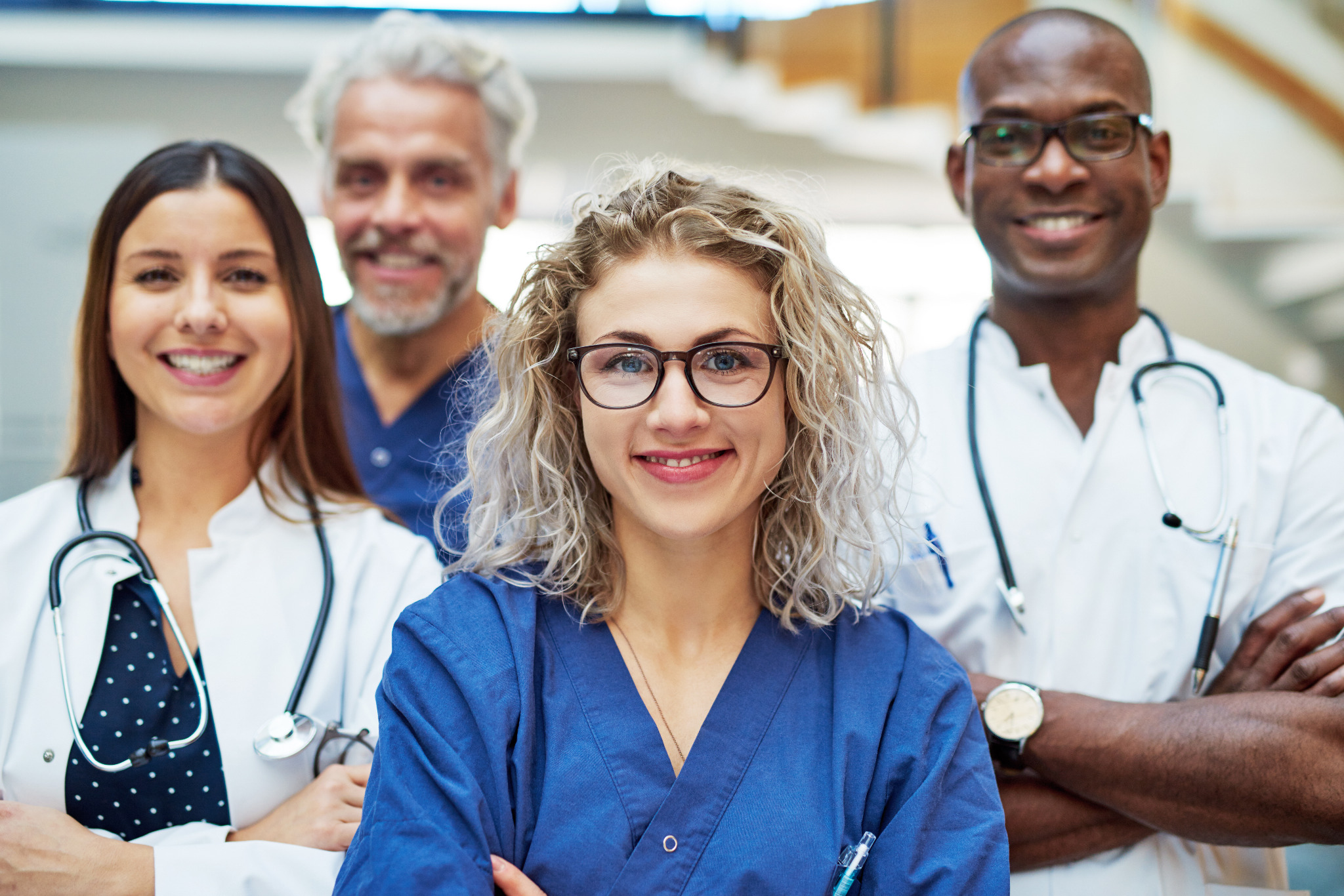 Licensed medical providers smiling together.
